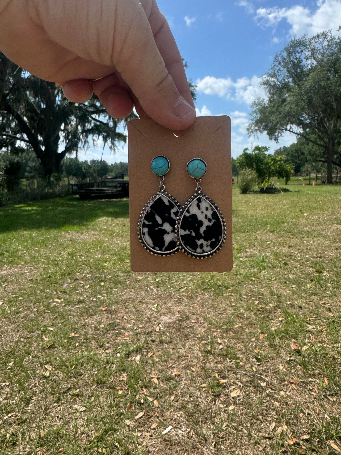 Dangle Droplet Cow Print Teal Earrings